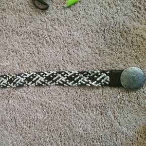 Wide belt with large decorative buckle